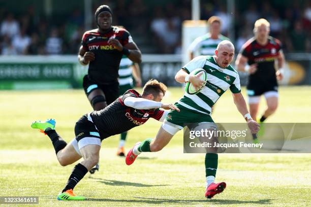 Max Bodilly of Ealing Trailfinders is tackled by Elliot Daly of Saracens the Greene King IPA Championship Play Off Final 1st Leg match between Ealing...