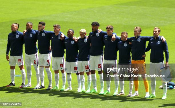 England stand together for the national anthem ahead of the UEFA Euro 2020 Championship Group D match between England and Croatia on June 13, 2021 in...