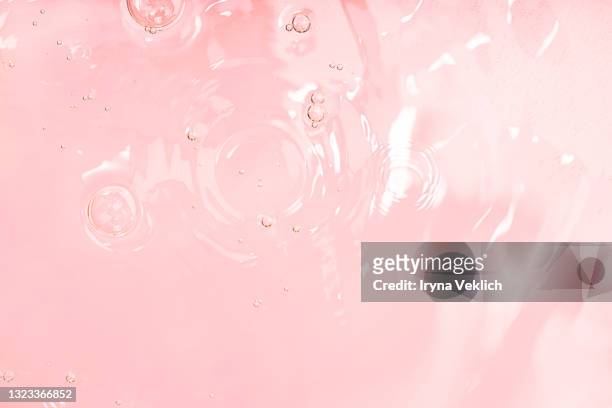 abstract background with moisturizing cleansing cosmetic gel, pure water or face serum, essential oil with oxygen aqua bubbles and waves. - oil liquid ストックフォトと画像