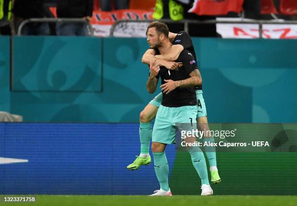 Marko Arnautovic of Austria celebrates after scoring their side's third goal during the UEFA Euro 2020 Championship Group C match between Austria and...