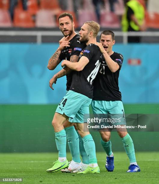 Marko Arnautovic of Austria celebrates with Konrad Laimer and Stefan Lainer after scoring their side's third goal during the UEFA Euro 2020...