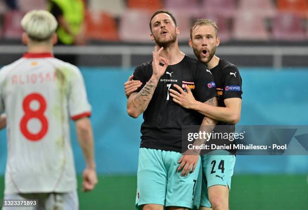 Marko Arnautovic of Austria celebrates with Konrad Laimer after scoring their side's third goal during the UEFA Euro 2020 Championship Group C match...