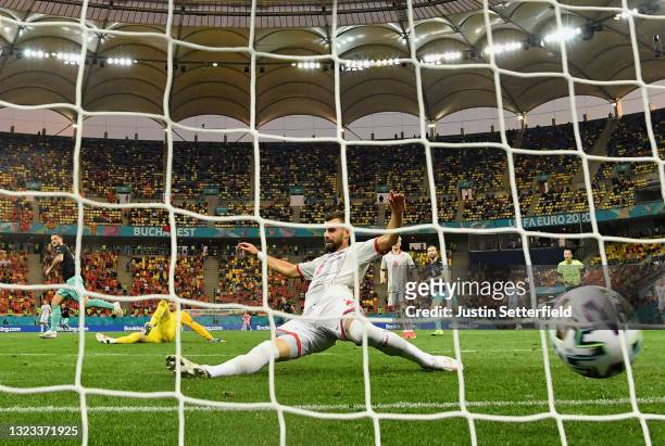 Egzon Bejtulai of North Macedonia attempts to block as Marko Arnautovic of Austria scores their side's third goal during the UEFA Euro 2020...