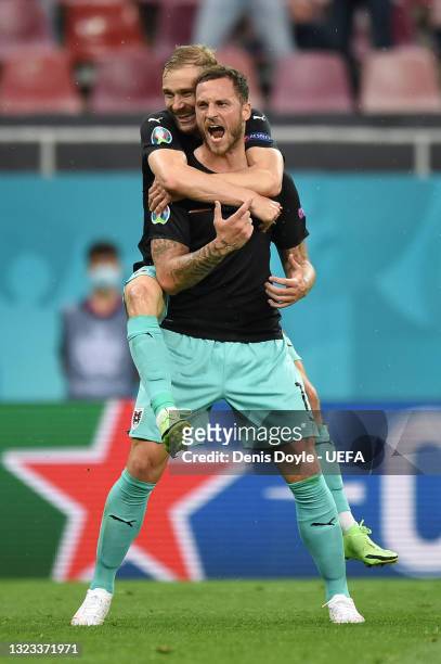 Marko Arnautovic of Austria celebrates with Konrad Laimer after scoring their side's third goal during the UEFA Euro 2020 Championship Group C match...