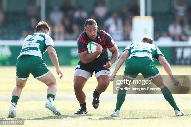 Billy Vunipola of Saracens gets tackled by Matt Gordon of Ealing Trailfinders and Craig Willis of Ealing Trailfinders during the Greene King IPA...