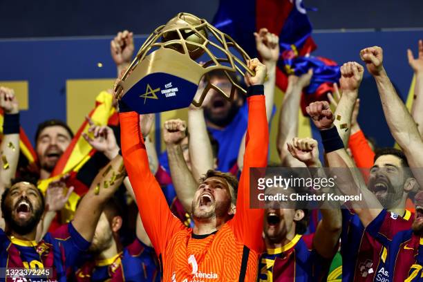 Gonzalo Perez de Vargas Moreno of FC Barcelona lifts the trophy on the podium after the VELUX EHF Champions League FINAL4 final match between FC...