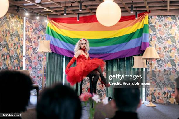 latin drag queen from bogota colombia between 30 and 39 years old, presents her theatrical work to her followers during the performance inside the theater on the day of gay pride - cross dressing stock pictures, royalty-free photos & images