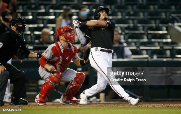 Josh Rojas of the Arizona Diamondbacks hits a solo home run against the Los Angeles Angels during the seventh inning of the MLB game at Chase Field...