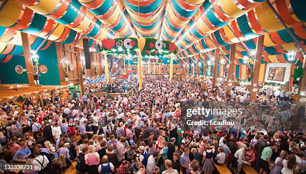 beer fest from within  tent - oktoberfest stock-fotos und bilder