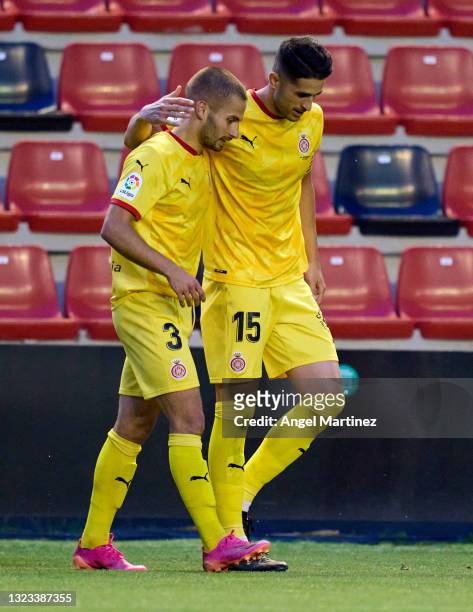 Enric Franquesa of Girona FC celebrates with Juanpe Ramirez after scoring their side's first goal during the La Liga Smartbank Playoff Final 1st Leg...