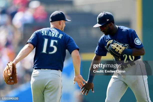 Taylor Trammell and Kyle Seager of the Seattle Mariners celebrate their 6-2 win over the Cleveland Indians at Progressive Field on June 13, 2021 in...