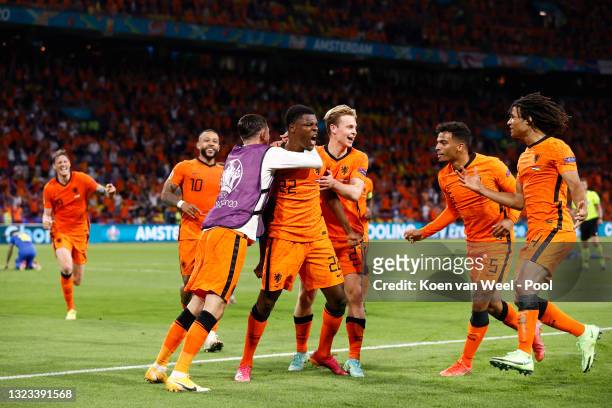 Denzel Dumfries of Netherlands celebrates with Frenkie de Jong and team mates after scoring their side's third goal during the UEFA Euro 2020...