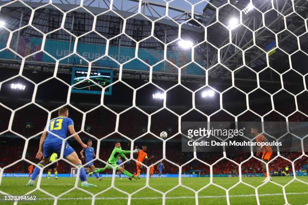 Georginio Wijnaldum of Netherlands scores their side's first goal past Georgiy Bushchan of Ukraine during the UEFA Euro 2020 Championship Group C...