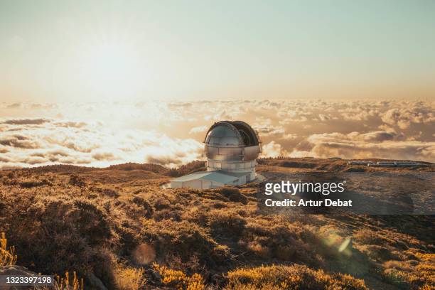 telescope observatory dome in top of la palma island above the clouds with clean sky in spain. - observatory stock pictures, royalty-free photos & images