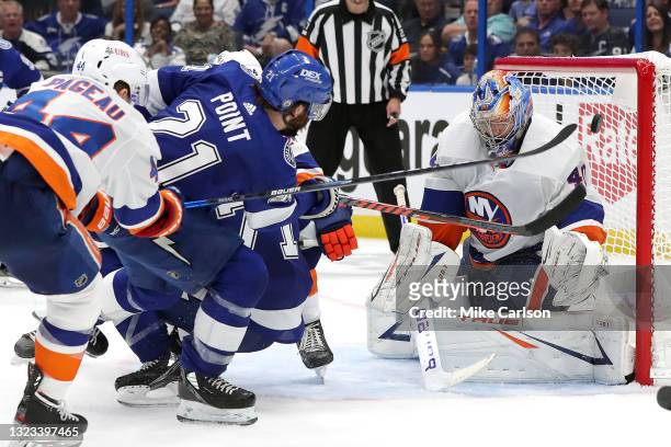 Brayden Point of the Tampa Bay Lightning scores a goal past Semyon Varlamov of the New York Islanders during the third period in Game One of the...