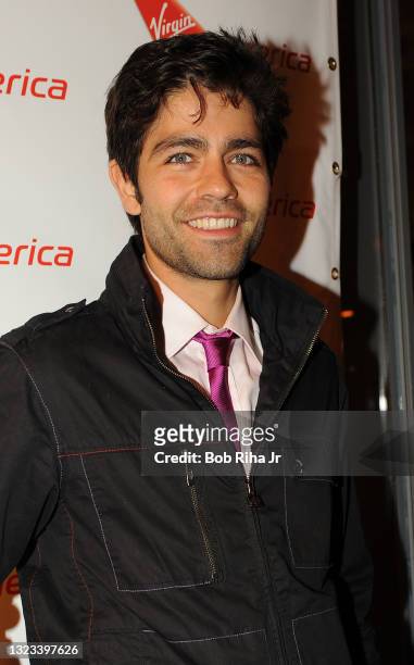 Actor Adrian Grenier stops for a photo as he arrives on the red carpet for a event, May 25, 2011 in Chicago, Illinois.