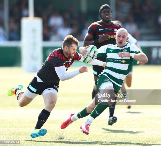 Max Bodilly of Ealing Trailfinders is tackled by Elliot Daly of Saracens the Greene King IPA Championship Play Off Final 1st Leg match between Ealing...