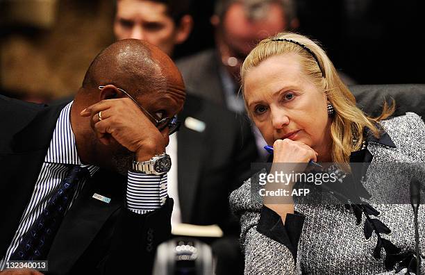 Secretary of State Hillary Rodham Clinton and US Trade Representatives Ron Kirk speak during the APEC Ministerial meeting on November 11, 2011 in...