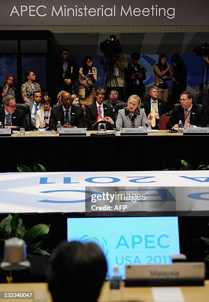 Secretary of State Hillary Rodham Clinton speaks as US Trade Representatives Ron Kirk looks on during the APEC Ministerial meeting on November 11,...