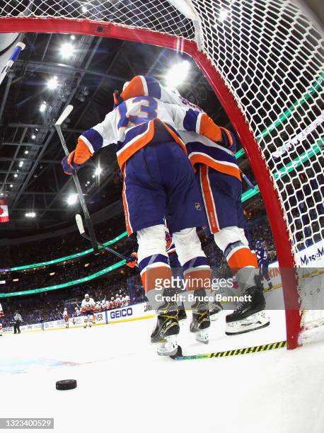 Mathew Barzal of the New York Islanders is congratulated by Anthony Beauvillier after scoring a goal against the Tampa Bay Lightning during the...