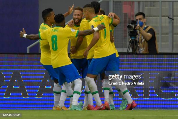 Neymar Jr. Of Brazil celebrates with teammates after scoring the second goal of his team during a Group B match between Brazil and Venezuela as part...