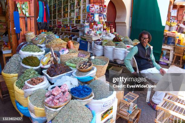 Man is selling traditional herbs, spices and mint tea in the Medina on March 09, 2020 in Marrakech, Morocco.