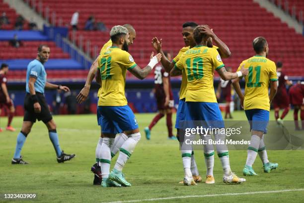 Gabriel Barbosa of Brazil celebrates with teammates after scoring the third goal of his team during a Group B match between Brazil and Venezuela as...