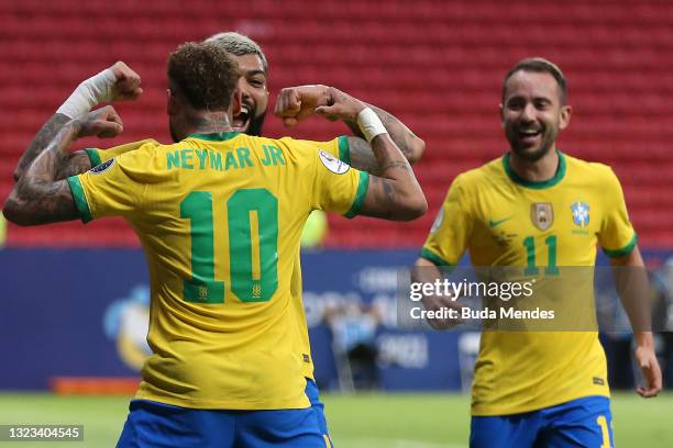 Gabriel Barbosa of Brazil celebrates with teammate Neymar Jr. After scoring the third goal of his team during a Group B match between Brazil and...