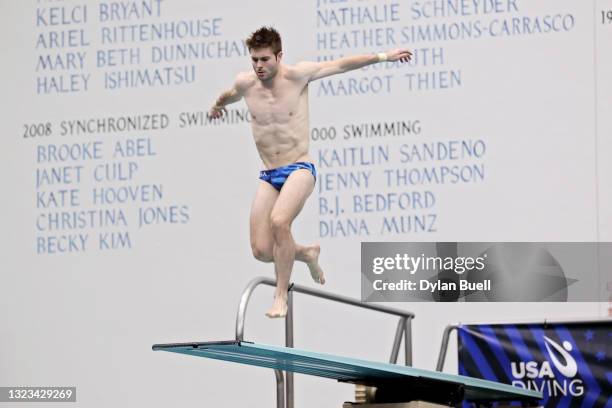 Michael Hixon competes in the men's 3-meter springboard final during day 8 of the 2021 U.S. Olympic Diving Trials at Indiana University Natatorium on...