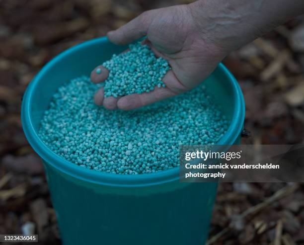 npk fertiliser - lawn fertilizer stock pictures, royalty-free photos & images