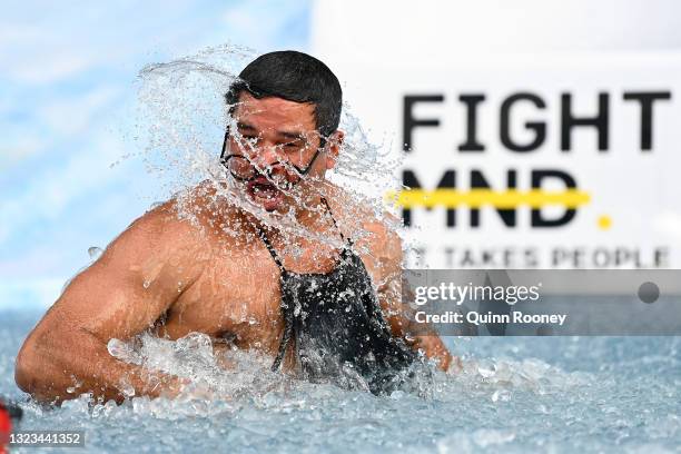 Jeff Farmer goes down the slide during the Big Freeze slide at Melbourne Cricket Ground on June 14, 2021 in Melbourne, Australia. The annual event...