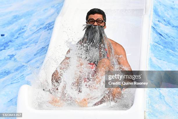 Jeff Farmer goes down the slide during the Big Freeze slide at Melbourne Cricket Ground on June 14, 2021 in Melbourne, Australia. The annual event...