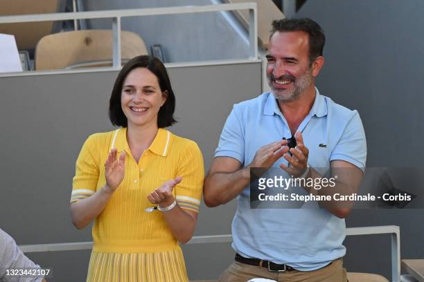 Nathalie Pechalat and Jean Dujardin attend the French Open 2021 at Roland Garros on June 13, 2021 in Paris, France.