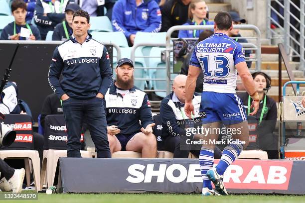 Bulldogs coach Trent Barrett looks dejected as Josh Jackson of the Bulldogs leaves the field after being sent off for 10 minutes during the round 14...