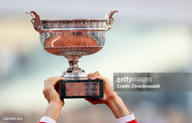 Novak Djokovic of Serbia holds the trophy after winning his Men's Singles Final match against Stefanos Tsitsipas of Greece during Day Fifteen of the...
