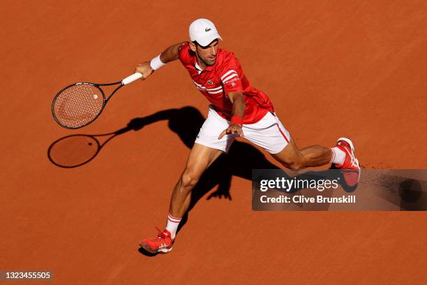 Novak Djokovic of Serbia runs to play a forehand in his Men's Singles Final match against Stefanos Tsitsipas of Greece during Day Fifteen of the 2021...