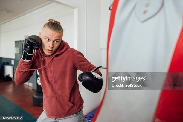 boxing training in the gym - boxboll bildbanksfoton och bilder