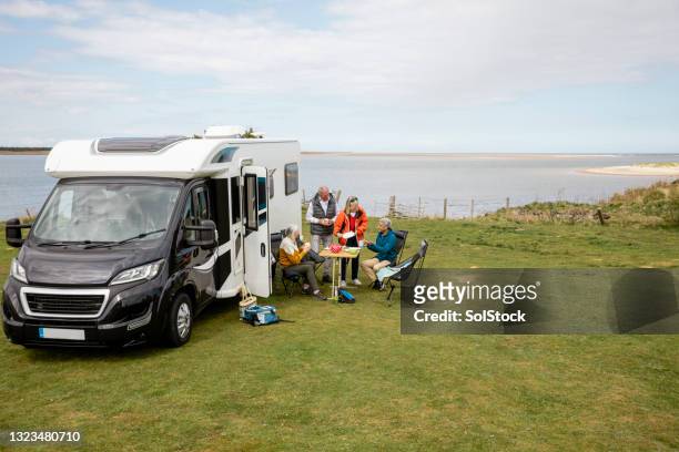 senior couple staycation - caravan uk stock-fotos und bilder