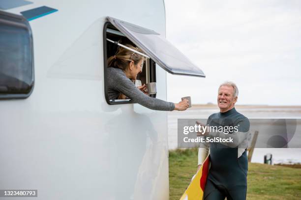 time to warm up! - camper trailer stock pictures, royalty-free photos & images