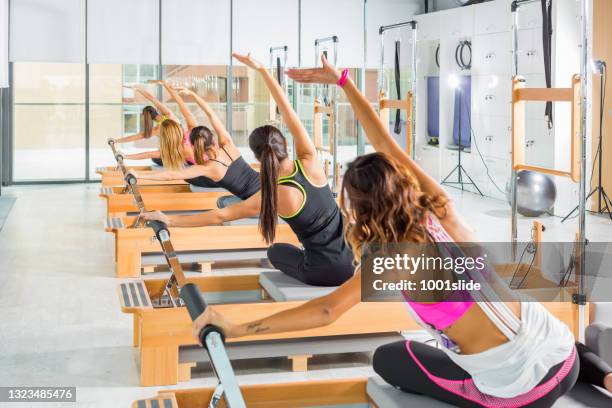 pilate class - reformer stock pictures, royalty-free photos & images