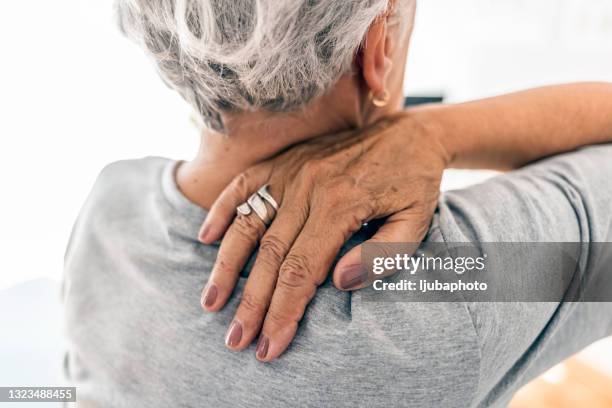 i need a painkiller - person with a neck pain stock pictures, royalty-free photos & images