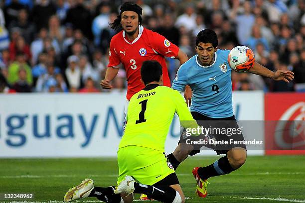 Luis Suarez from Uruguay's runs for the ball during match South American Qualifiers for FIFA World Cup Brazil 2014 at Centenary Stadium on November...