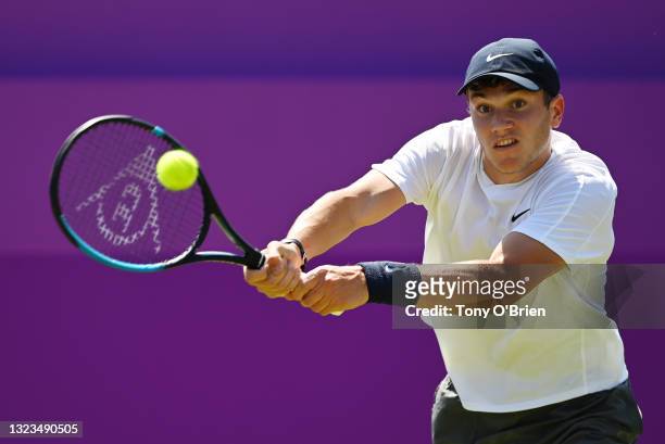 Jack Draper of Great Britain plays a backhand in his First Round match against Jannik Sinner of Italy during Day 1 of the cinch Championships at The...