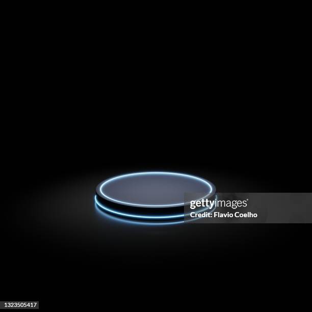 round stage lit by neon lights on black background - fashion show stage stock pictures, royalty-free photos & images