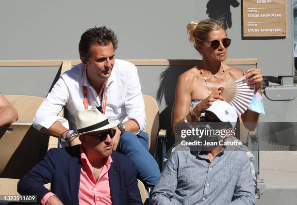 Yannick Bollore and his wife Chloe Bollore attends the Men's Singles Final during day 15 of the 2021 Roland-Garros, French Open, a Grand Slam tennis...