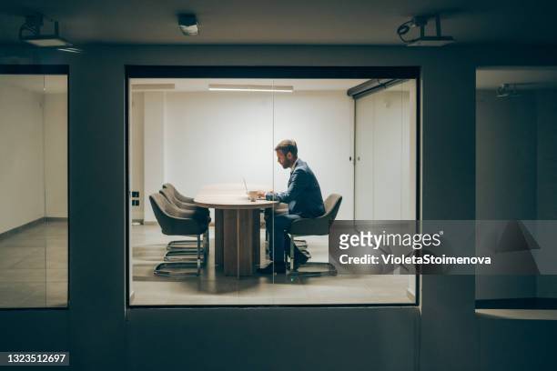 businessman working late in the office. - office solitude stock pictures, royalty-free photos & images