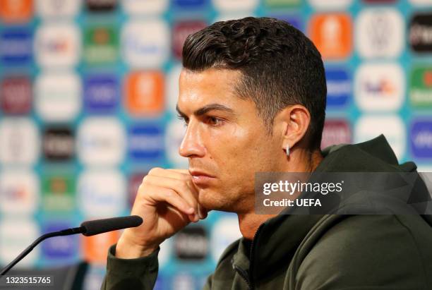 In this Handout picture provided by UEFA, Cristiano Ronaldo of Portugal speaks to the media during the Portugal Press Conference ahead of the Euro...