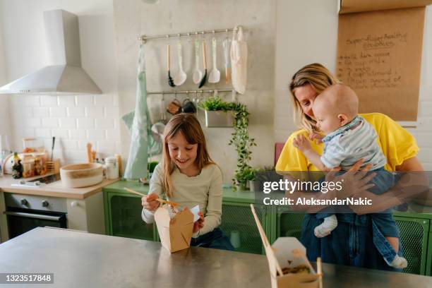 family's having take out food for dinner - chinese takeout stock pictures, royalty-free photos & images