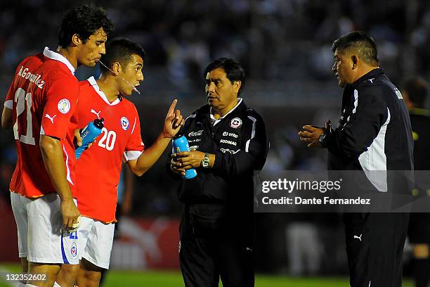 Chile's coach Claudio Borghi watches his players during their match between Uruguay and Chile as part of the third round of the the South American...