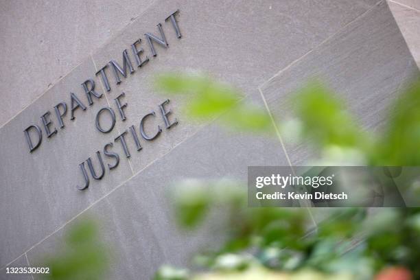 Sign at the U.S. Department of Justice is seen on June 14, 2021 in Washington, DC. U.S. Attorney General is expected to meet with media executives,...